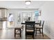 Bright dining area with table, bench, and bay window at 4392 Overlook Dr, Acworth, GA 30101