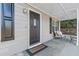 Front porch with dark door, seating, and rug at 4392 Overlook Dr, Acworth, GA 30101