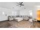 Living room with hardwood floors, sectional sofa, and large TV at 4392 Overlook Dr, Acworth, GA 30101