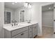 Bathroom with double vanity and access to closet at 731 Stickley Oak Way, Woodstock, GA 30189