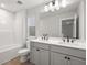 Bathroom with double vanity, tub, and toilet at 731 Stickley Oak Way, Woodstock, GA 30189