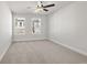 Bright bedroom with carpeted floor and ceiling fan at 731 Stickley Oak Way, Woodstock, GA 30189