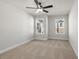 Bedroom with two windows, ceiling fan, and carpet at 731 Stickley Oak Way, Woodstock, GA 30189