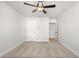 Well-lit bedroom with ceiling fan and access to hallway at 731 Stickley Oak Way, Woodstock, GA 30189