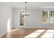 Light-filled dining area with hardwood floors and a view to the backyard at 731 Stickley Oak Way, Woodstock, GA 30189