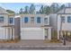 Gray two-story home with white garage door and landscaping at 731 Stickley Oak Way, Woodstock, GA 30189