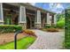 Elegant home entrance with stone facade and landscaped walkway at 731 Stickley Oak Way, Woodstock, GA 30189