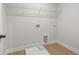 Laundry room with vinyl flooring and overhead shelving at 731 Stickley Oak Way, Woodstock, GA 30189