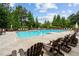 Inviting community pool with plenty of lounge chairs at 731 Stickley Oak Way, Woodstock, GA 30189