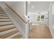 Modern staircase with light wood treads and white risers at 731 Stickley Oak Way, Woodstock, GA 30189