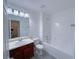 Bathroom with tub, toilet and wood vanity at 4222 High Park Ln, Atlanta, GA 30344