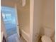 Bathroom with tub, toilet and vinyl flooring at 4222 High Park Ln, Atlanta, GA 30344