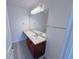 Full bathroom with wood vanity and updated fixtures at 4222 High Park Ln, Atlanta, GA 30344