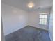 Bright bedroom with grey carpet and window at 4222 High Park Ln, Atlanta, GA 30344