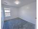 Simple bedroom with grey carpet and window at 4222 High Park Ln, Atlanta, GA 30344