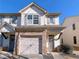 Two-story townhome with stone accents and a two-car garage at 4222 High Park Ln, Atlanta, GA 30344