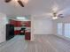 Open-concept living room and kitchen with LVP flooring at 4222 High Park Ln, Atlanta, GA 30344