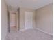 Cozy bedroom features neutral carpet flooring and two entryways at 3406 Mount Zion Rd, Stockbridge, GA 30281