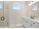 Clean bathroom with a walk-in shower and double vanity at 89 Batten Board Way, Woodstock, GA 30189