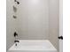 Clean bathroom with a shower/tub combo and modern fixtures at 89 Batten Board Way, Woodstock, GA 30189