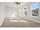 Bright bedroom with carpet flooring and large windows at 89 Batten Board Way, Woodstock, GA 30189