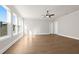 Sunlit bedroom with hardwood floors and a ceiling fan at 89 Batten Board Way, Woodstock, GA 30189