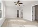 Spacious bedroom featuring carpet, ceiling fan, and ensuite access at 89 Batten Board Way, Woodstock, GA 30189