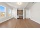 Bonus room with hardwood floors, wet bar, and built-in shelving at 89 Batten Board Way, Woodstock, GA 30189