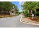 Gated entrance to a community with landscaping and signage at 89 Batten Board Way, Woodstock, GA 30189