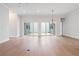 Dining room with hardwood floors and sliding glass doors to patio at 89 Batten Board Way, Woodstock, GA 30189