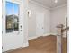 Bright foyer with hardwood floors and white trim at 89 Batten Board Way, Woodstock, GA 30189