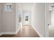 Bright hallway with hardwood floors and access to exterior at 89 Batten Board Way, Woodstock, GA 30189