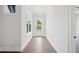 Light-filled hallway with wood floors and exterior access at 89 Batten Board Way, Woodstock, GA 30189