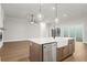 Kitchen island with farmhouse sink, stainless steel dishwasher at 89 Batten Board Way, Woodstock, GA 30189