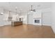 Open concept kitchen with island, stainless steel appliances, and white cabinetry at 89 Batten Board Way, Woodstock, GA 30189