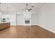 Living room with hardwood floors, fireplace, and high ceilings at 89 Batten Board Way, Woodstock, GA 30189