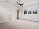 Main bedroom with ensuite bathroom access and ceiling fan at 89 Batten Board Way, Woodstock, GA 30189