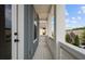 White porch with white railings and blue siding at 89 Batten Board Way, Woodstock, GA 30189