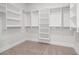 Spacious walk-in closet with ample shelving and hanging space at 89 Batten Board Way, Woodstock, GA 30189