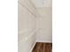 Walk in closet with a dark wood floor and white wire shelves for storage at 1016 Old Holcomb Bridge Rd, Roswell, GA 30076