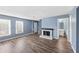 Living room with fireplace and stairs to upper level at 1016 Old Holcomb Bridge Rd, Roswell, GA 30076