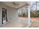 Covered patio with ceiling fan and fenced yard at 236 Hickory Commons Way, Canton, GA 30115