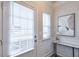 Bright entryway with white door, window blinds, and a small console table at 236 Hickory Commons Way, Canton, GA 30115