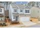 Two-story house with gray siding, brick accents, and a two-car garage at 236 Hickory Commons Way, Canton, GA 30115