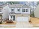 Two-story house with gray siding, brick accents, and a two-car garage at 236 Hickory Commons Way, Canton, GA 30115