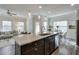 Modern kitchen with large island, granite counters, and stainless steel appliances at 236 Hickory Commons Way, Canton, GA 30115