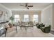 Bright living room featuring a comfy sofa and large windows at 236 Hickory Commons Way, Canton, GA 30115