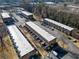 Overhead view of a townhome complex showcasing manicured lawns and ample parking at 245 Winding River Dr # E, Atlanta, GA 30350