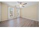 Bright and airy bedroom with laminate flooring and large windows with natural light at 245 Winding River Dr # E, Atlanta, GA 30350