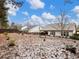 Large backyard with a partial view of the house and snowy ground at 3578 Crayton Glen Way, Buford, GA 30519